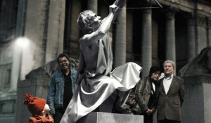 People admire a statue illuminated with Philips white light