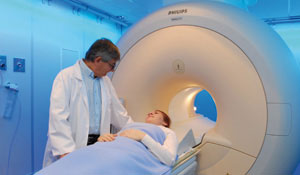Doctor prepares a patient for an MRI exam