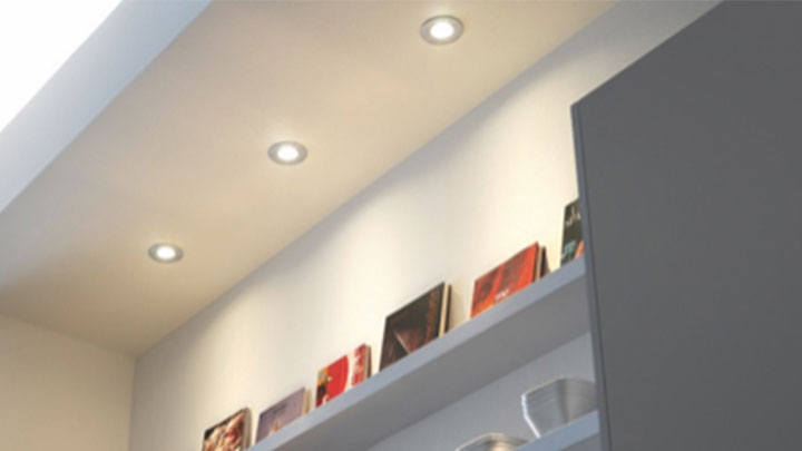 Philips LED spots highlighting a bookshelf