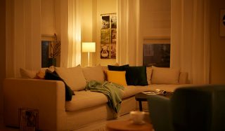 "Cozy living room illuminated by warm LED lighting, showcasing energy-efficient home ambiance with smart bulbs"